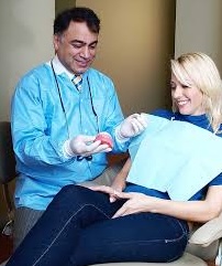 Dr. Sam Gilani treating a patient