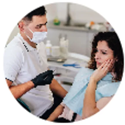 Periodontist discussing treatment with a patient